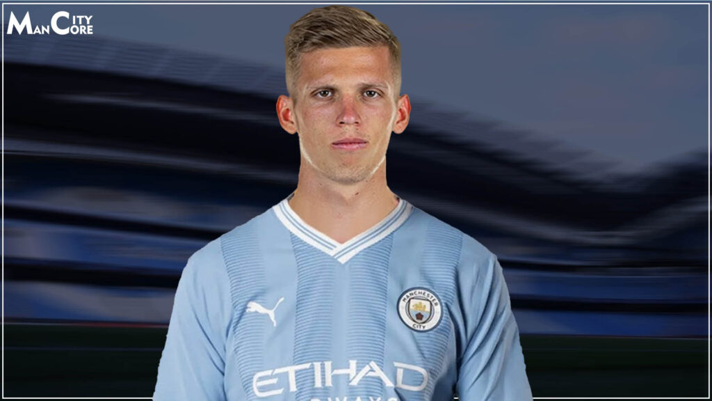  Dani Olmo is pictured in a Manchester City kit with a serious look on his face.